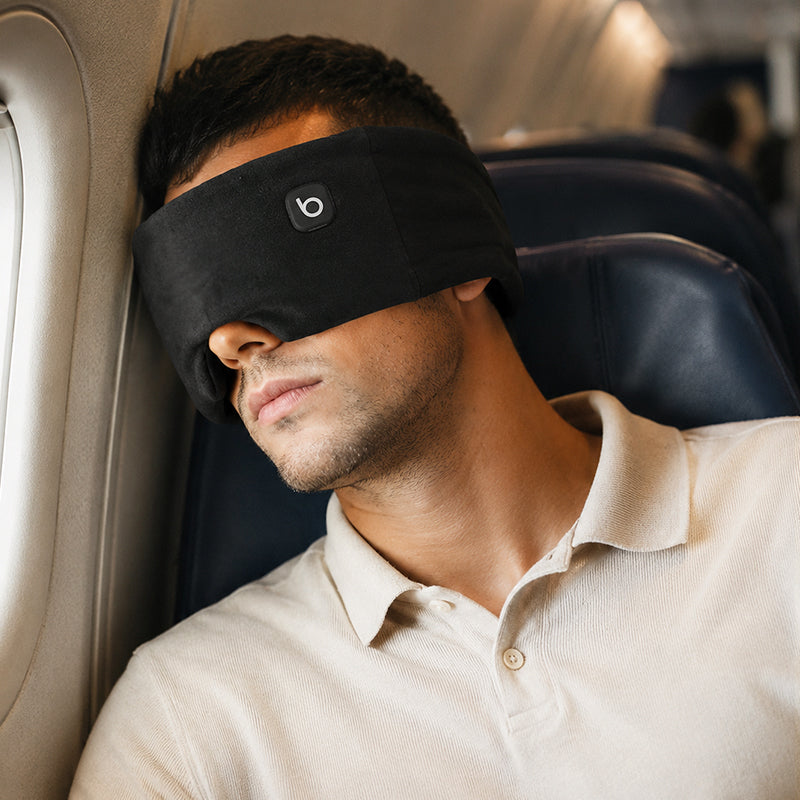 Bwarm heated weighted eye sleep mask made of soft cotton, designed to provide gentle warmth and comfort for relaxing sleep.