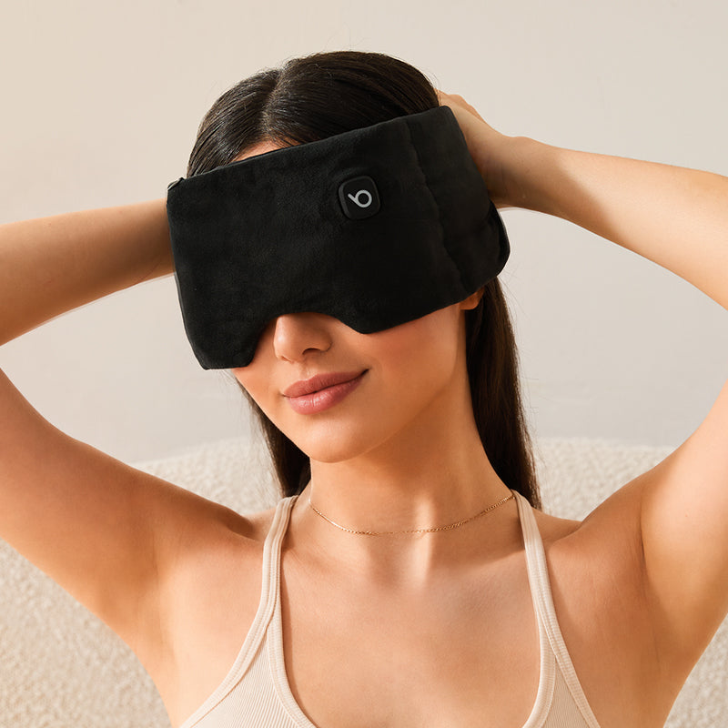 Bwarm heated weighted eye sleep mask made of soft cotton, designed for relaxing and soothing eye comfort during rest.
